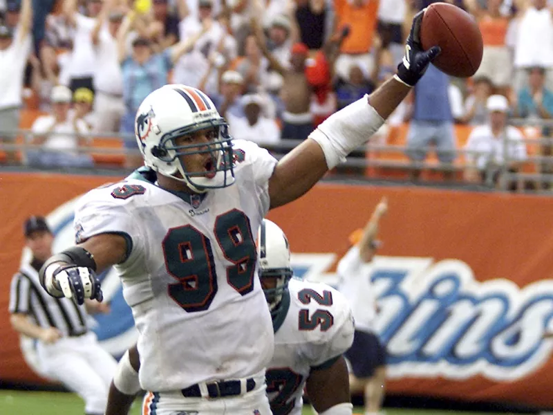 Miami Dolphins' Jason Taylor scores