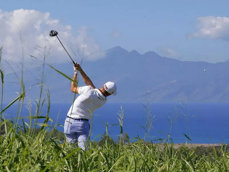 Justin Thomas hits from the seventh tee at the Kapalua Plantation Course on Kapalua, Hawaii