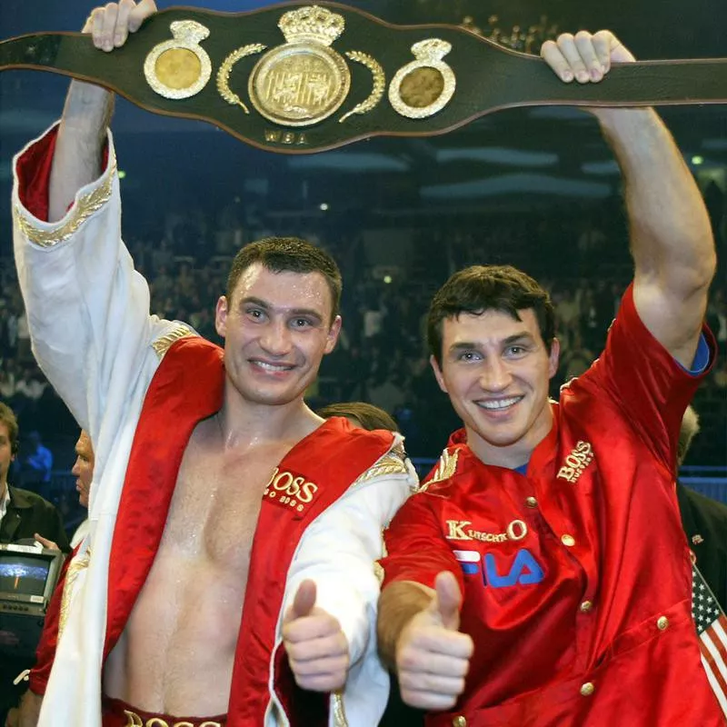 Wladimir Klitschko and Vitali Klitschko celebrate