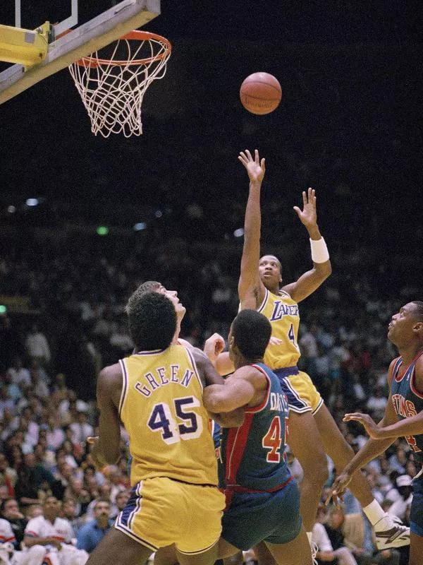 Byron Scott goes up for basket