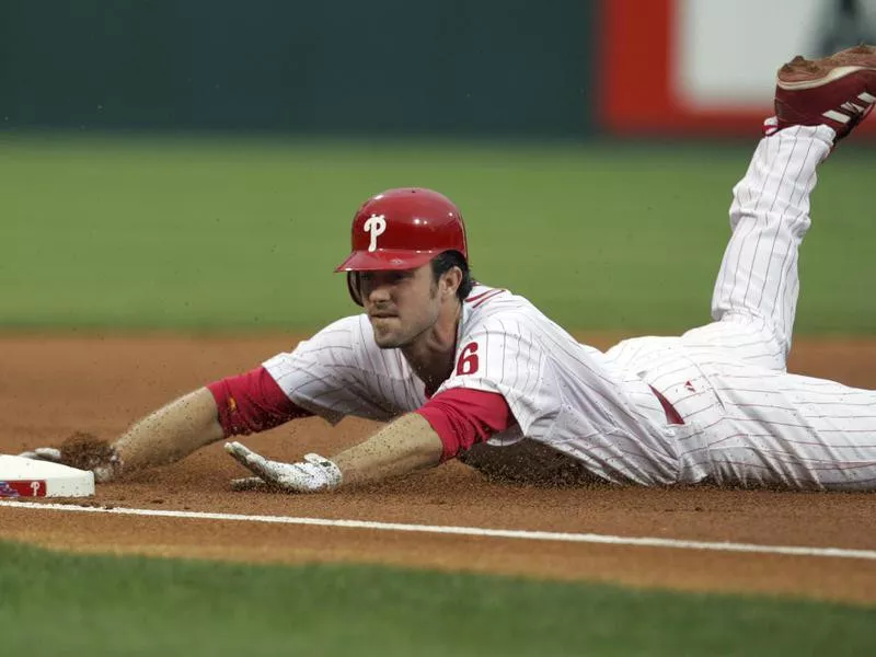 Chase Utley sliding into third base