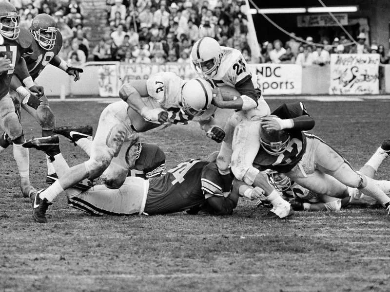 Penn State's Curt Warner gets a few yards