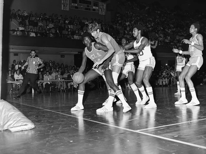 Bill Walton of UCLA dribbling