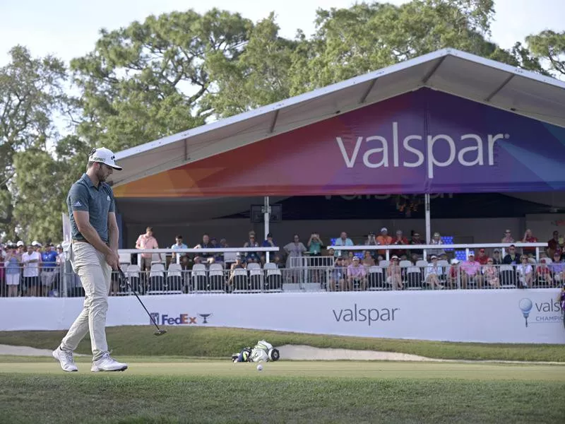 Sam Burns sets up to putt at the Valspar Championship