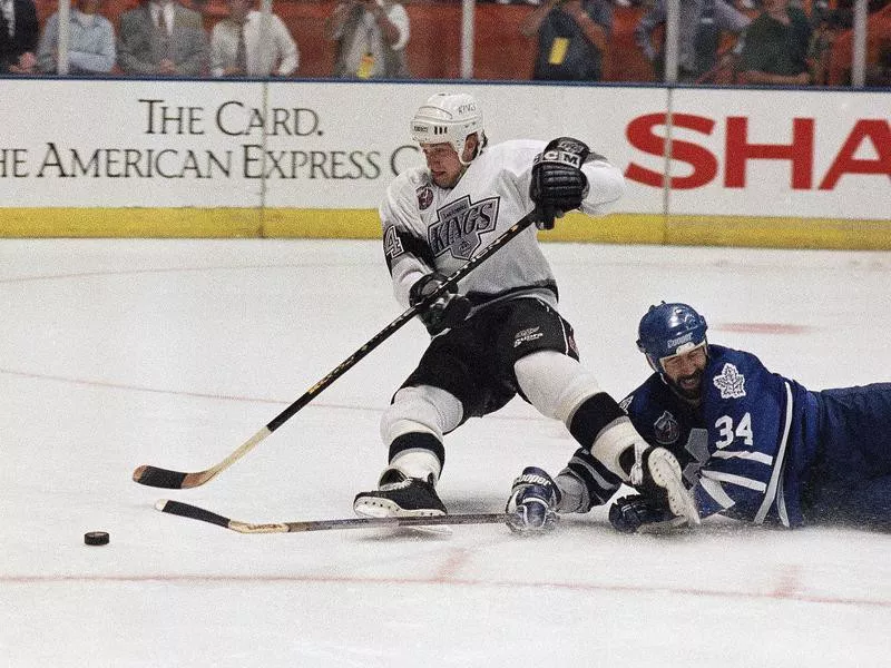 Los Angeles King Rob Blake and Toronto Maple Leaf Jamie Macoun battle