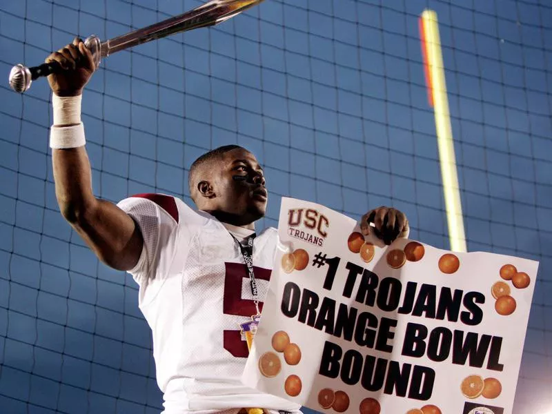 Tailback Reggie Bush celebrates with sword