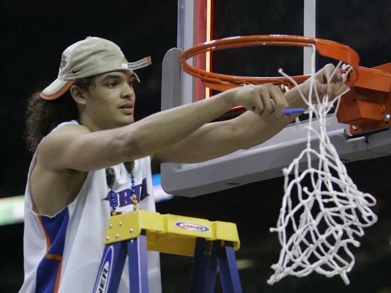 Florida Gator Joakim Noah cuts down the net