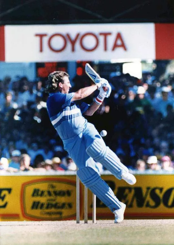 Ian Botham slams ball away