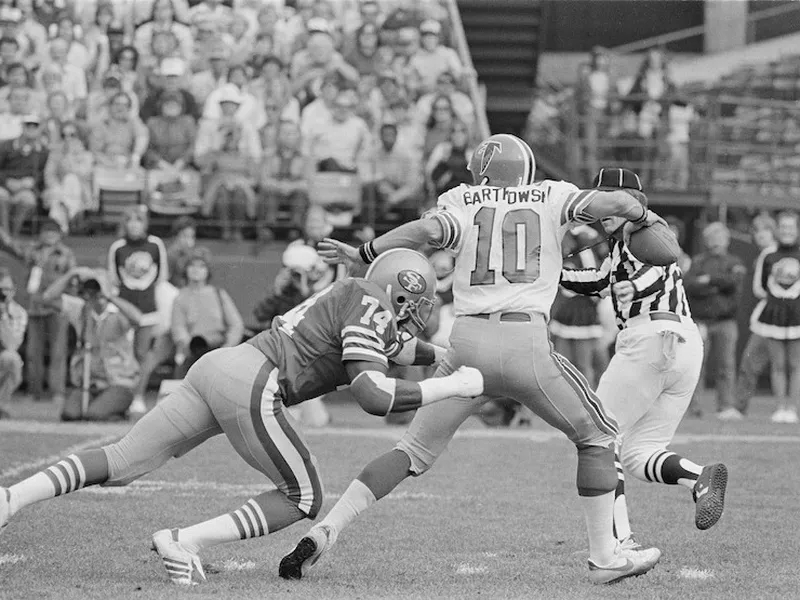 Fred Dean sacks Atlanta Falcons quarterback Steve Bartkowski