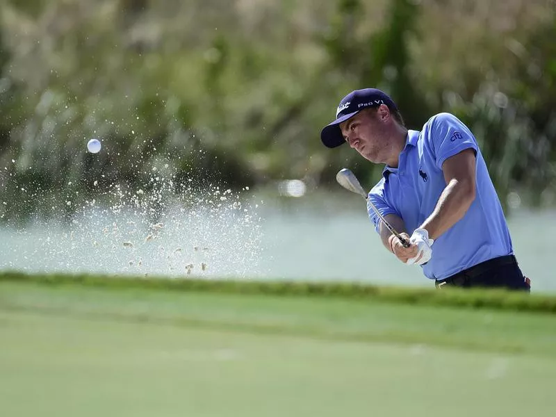 Justin Thomas hits from bunker