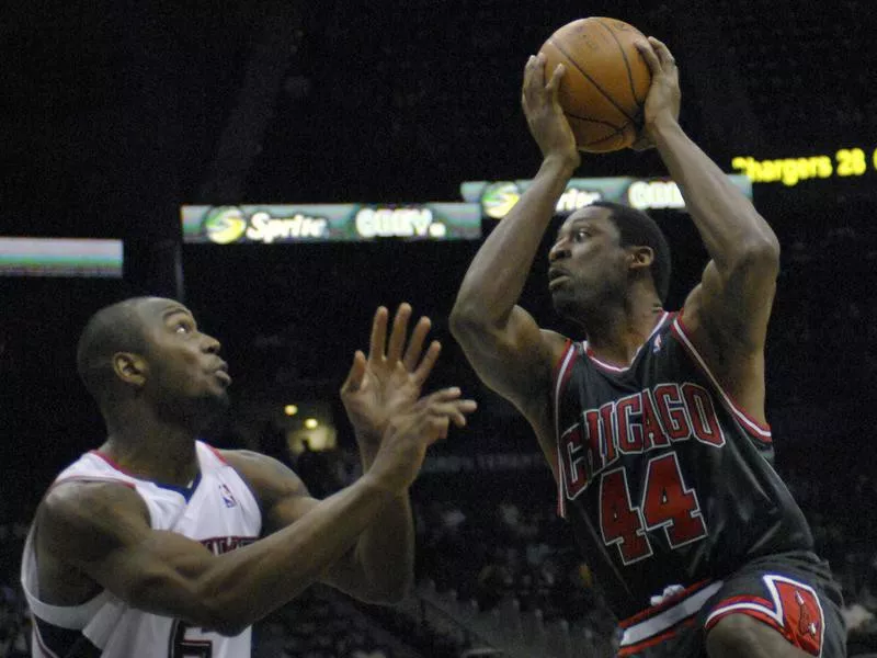 Adrian Griffin looks for shot against Mario West