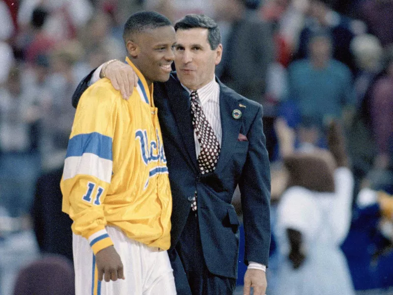 Tyus Edney celebrates with UCLA coach Jim Harrick