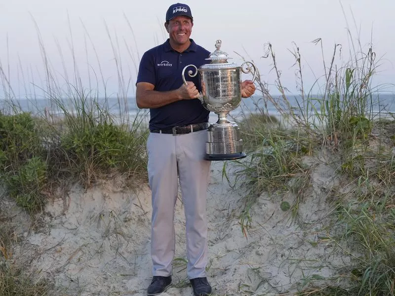 Phil Mickelson holds the Wanamaker Trophy