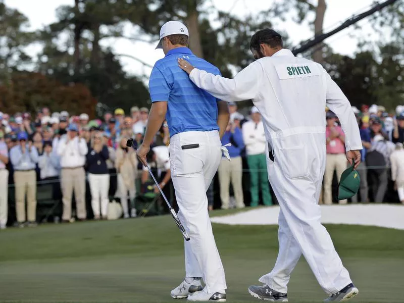 Jordan Spieth and his caddie