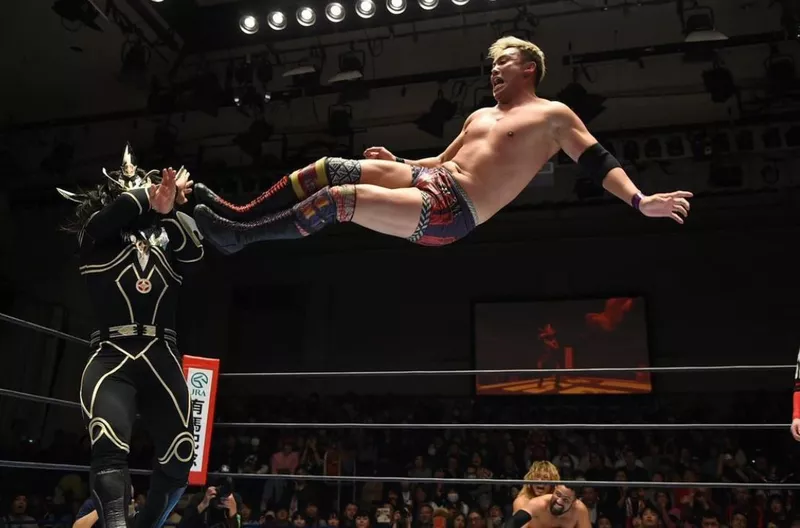 Okada giving a drop kick