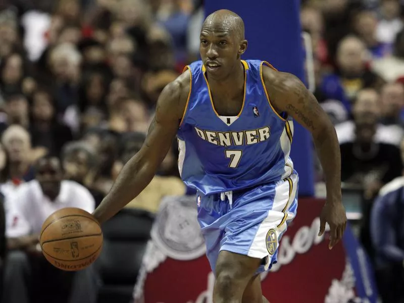 Chauncey Billups shoots against Pistons