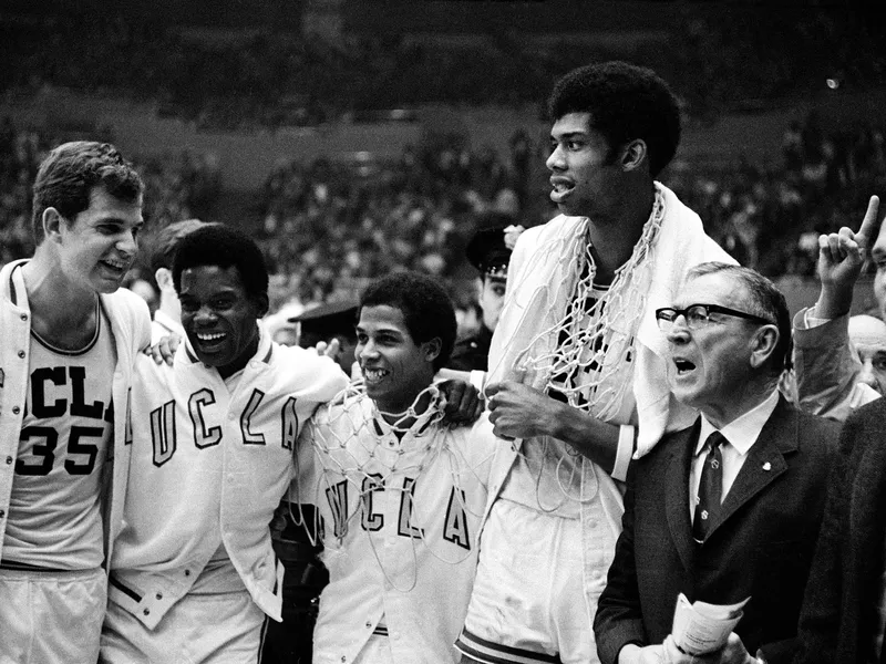 UCLA coach John Wooden celebrates with Mike Lynn, Lucius Allen, Mike Warren and Lew Alcindor after beating North Carolina