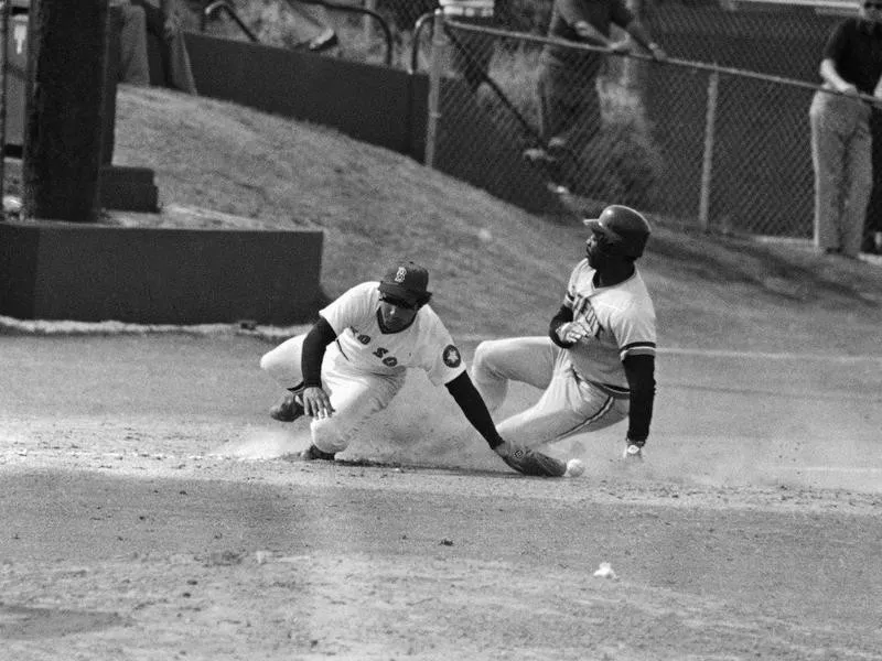 Ron LeFlore slides into third base stealing