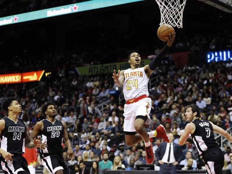 Kent Bazemore scores a basket