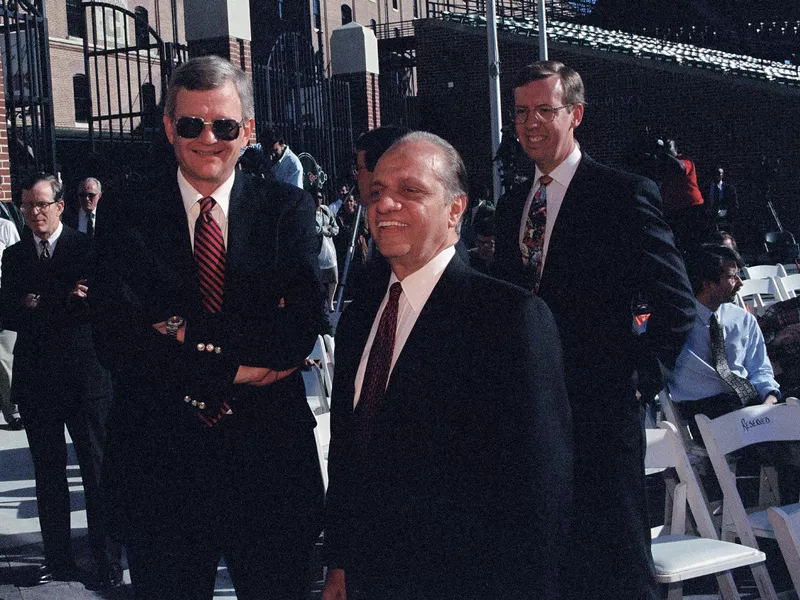 Peter Angelos shares a laugh with author Tom Clancy