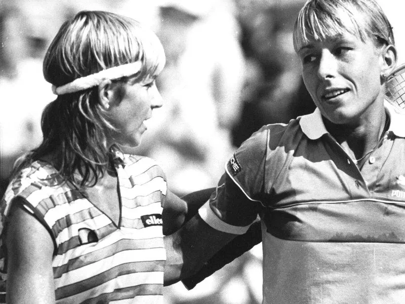 Martina Navratilova, right, is congratulated at the net by Chris Evert Lloyd.