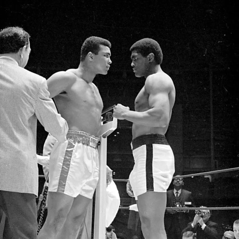 Heavyweight champion Cassius Clay and Ernie Terrell staring at each other