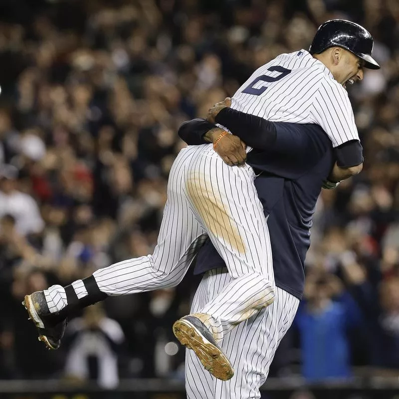 Derek Jeter celebrates with C.C. Sebathia