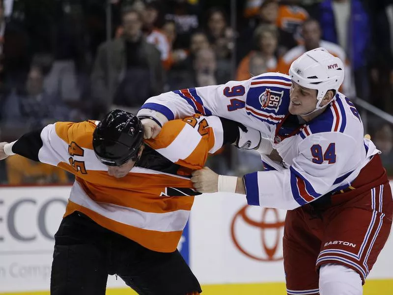 Philadelphia Flyers' Jody Shelley and New York Rangers' Derek Boogaard fight