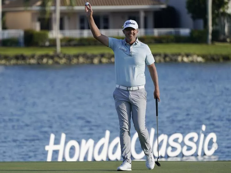 Matt Jones raises ball after winning Honda Classic golf tournament