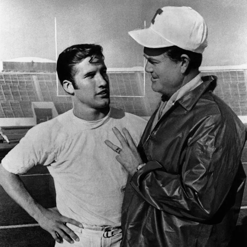 Darrell Royal chatting with star quarterback James Street