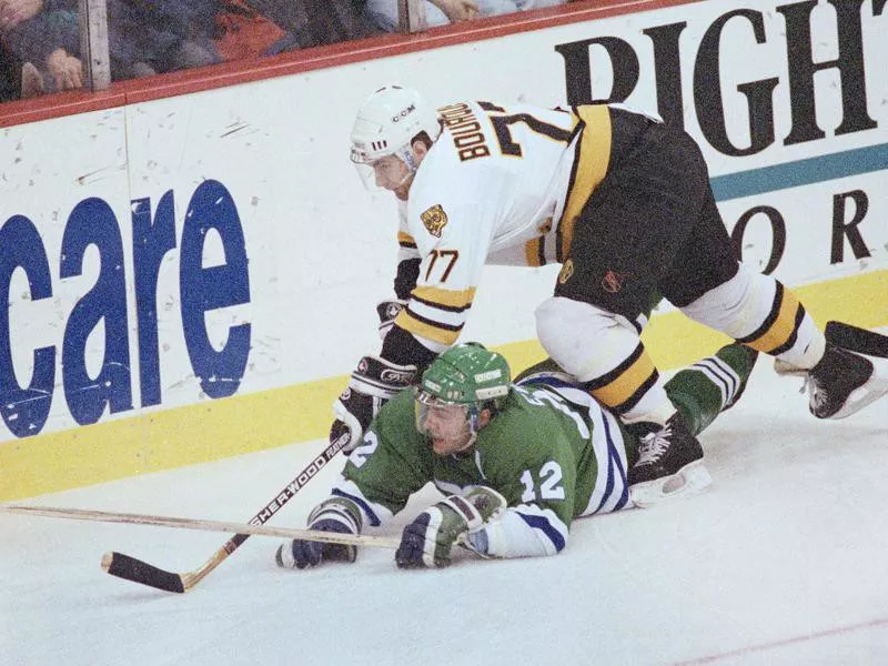 Ray Bourque in action against Dean Evason