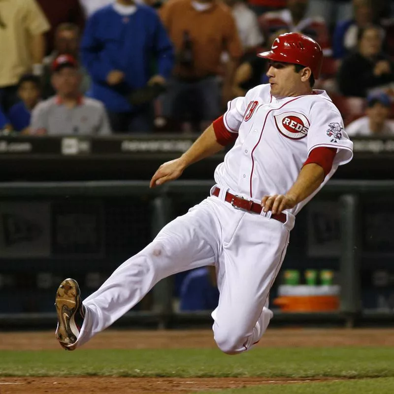 Cincinnati Reds' Joey Votto slides into home